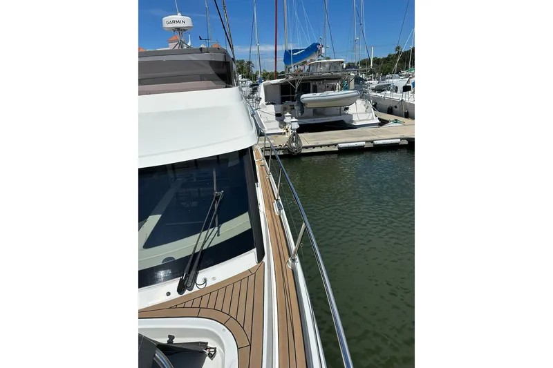 Slide: The Image of 2024 Beneteau Antares 11 Fly docked, showcasing sleek design and modern features. - 15
