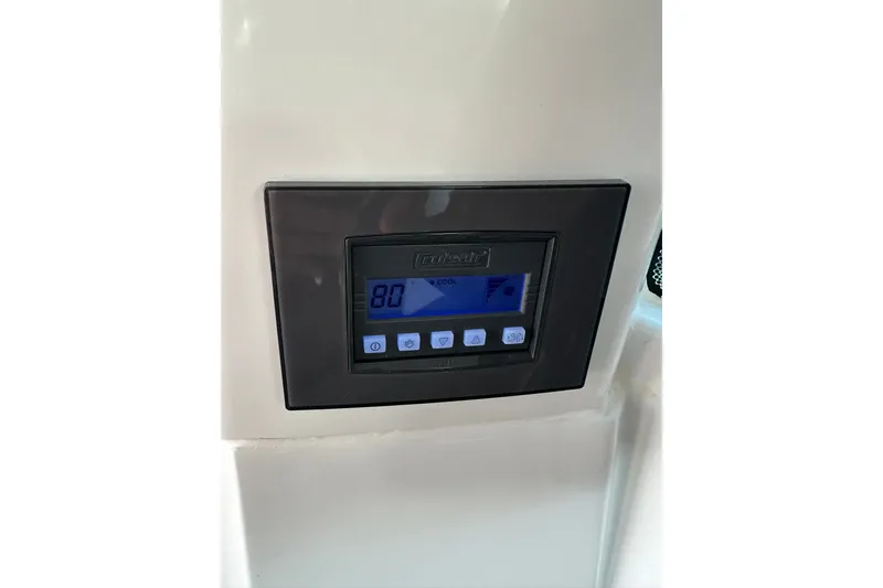 Slide: The Image of Control panel on 2024 Beneteau Antares 11 Fly, displaying temperature settings. - 70