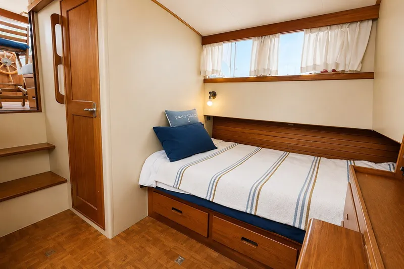 Slide: The Image of Cozy cabin interior of 1978 Grand Banks 36 Classic with bed and wooden furnishings. - 27