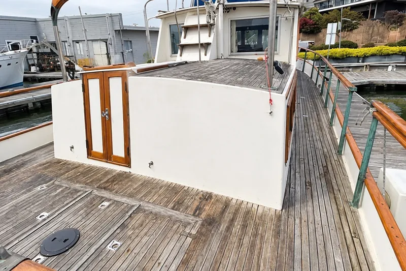 Slide: The Image of 1978 Grand Banks 36 Classic yacht with wooden deck and white cabin. - 10