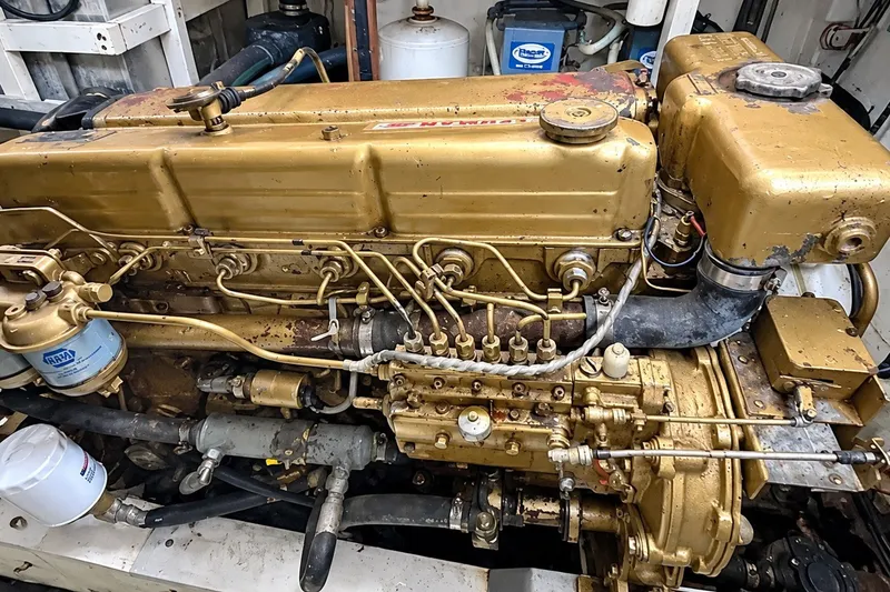 Slide: The Image of Engine of a 1978 Grand Banks 36 Classic boat, showcasing intricate mechanical components. - 34