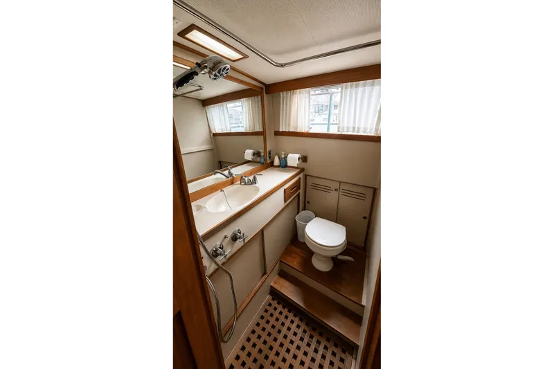 Slide: The Image of Bathroom interior of a 1978 Grand Banks 36 Classic yacht, featuring a sink and toilet. - 29