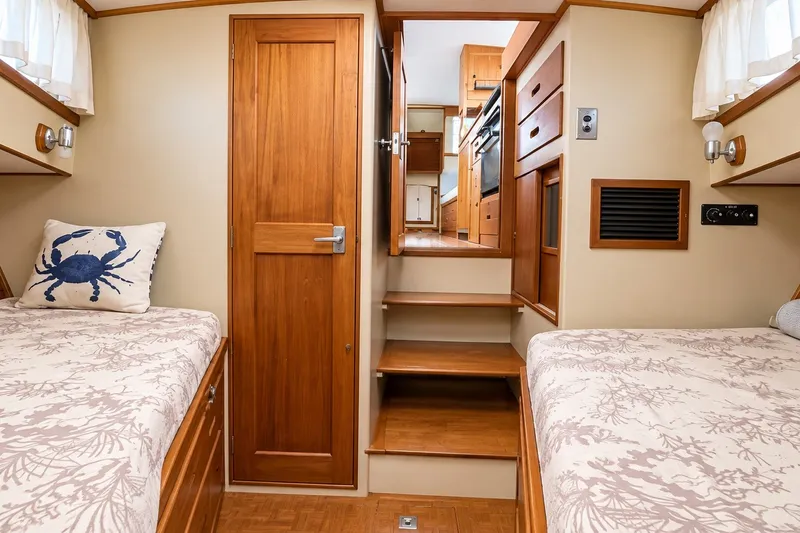 Slide: The Image of Interior of 1978 Grand Banks 36 Classic yacht with twin beds and wooden cabinetry. - 24