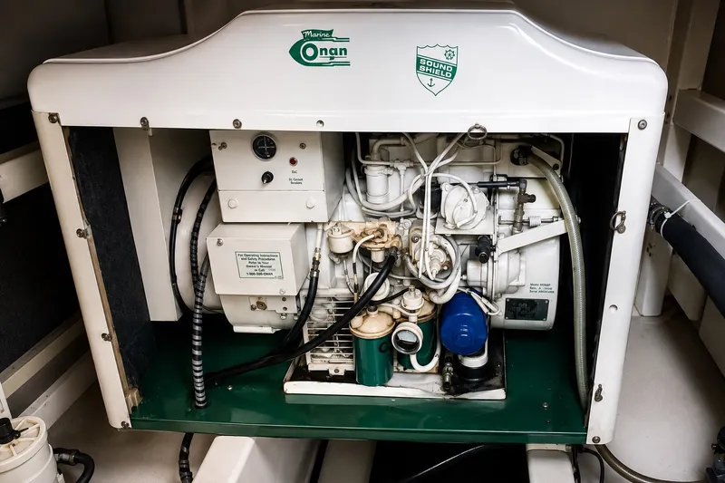 Slide: The Image of Marine Onan generator inside a 1978 Grand Banks 36 Classic yacht engine room. - 32
