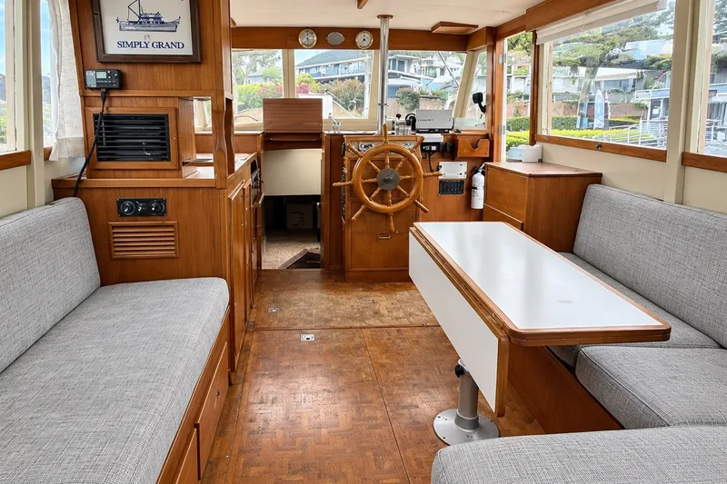Slide: The Image of Interior of a 1978 Grand Banks 36 Classic yacht with wooden finishes and seating area. - 20
