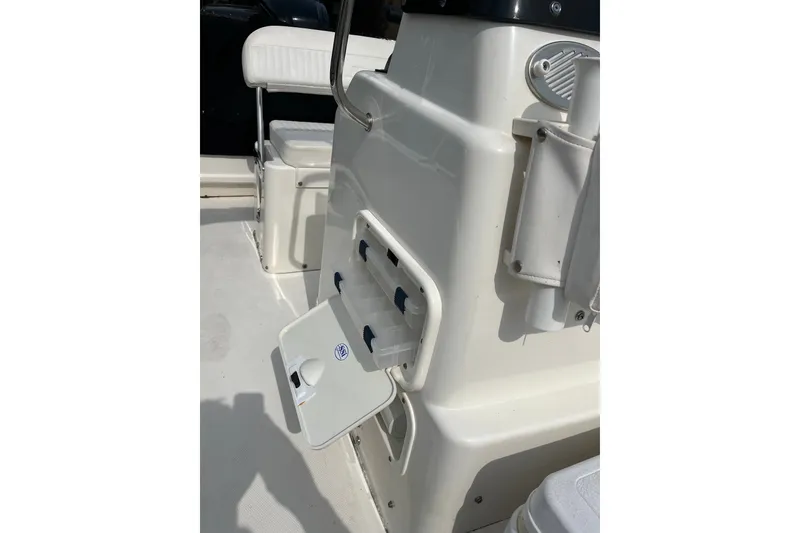 Slide: The Image of 2017 Boston Whaler 170 Montauk boat interior with storage compartment open. - 14
