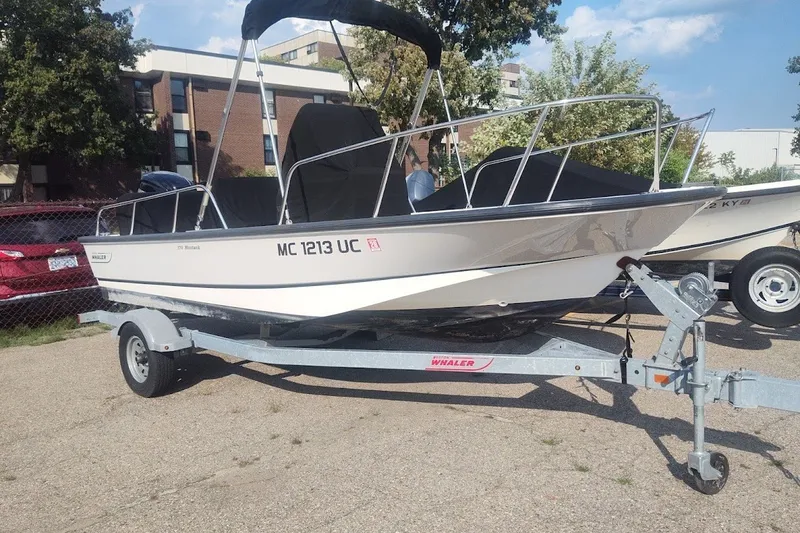 The Image of 2017 Boston Whaler 170 Montauk boat on trailer, parked outdoors. - 0
