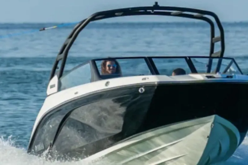 Slide: The Image of 2026 Yamaha Boats 222SE cruising on open water, showcasing sleek design and performance. - 4