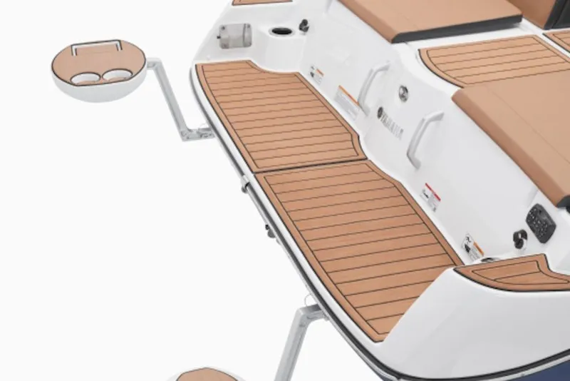Slide: The Image of 2026 Yamaha Boats 222SE swim platform with teak-style decking and cup holders. - 10