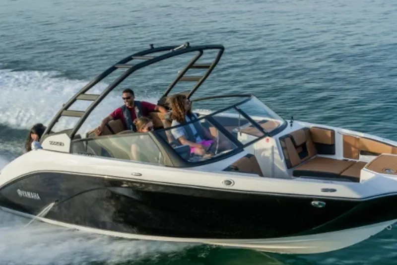Slide: The Image of 2027 Yamaha Boats 222SD cruising on water with passengers enjoying the ride. - 9