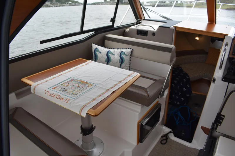 Slide: The Image of Interior of 2022 Cutwater C-248 Coupe with table and seating, Crystal River, FL decor. - 17