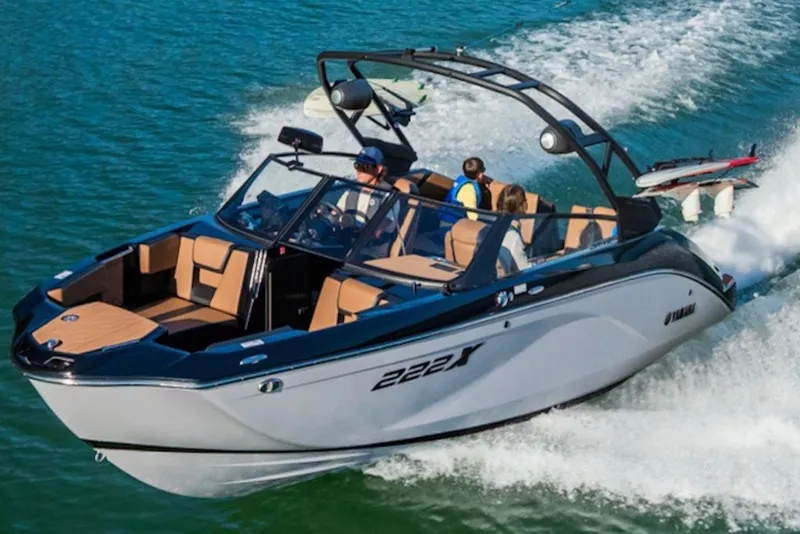 Slide: The Image of 2026 Yamaha Boats 222XE cruising on water with passengers enjoying the ride. - 3