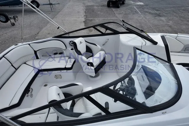 Slide: The Image of The image shows the cockpit of a 2027 Stingray 22DC boat with white and black seating. - 5