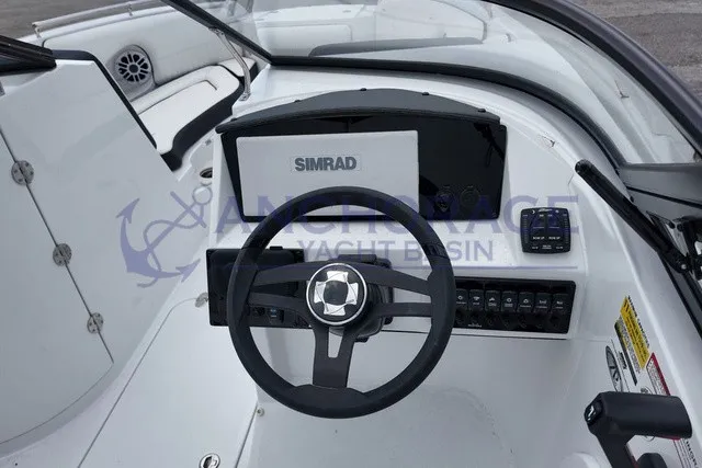 Slide: The Image of The image shows the cockpit of a 2027 Stingray 22DC with a Simrad display. - 6