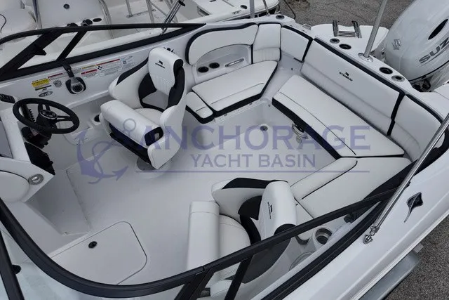 Slide: The Image of The image shows the cockpit of a 2027 Stingray 22DC boat with white seating. - 7