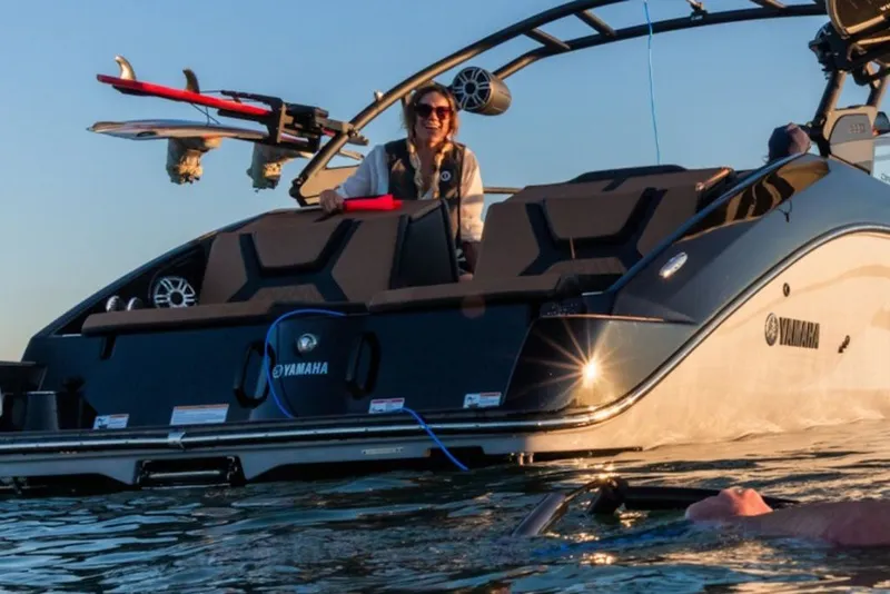 Slide: The Image of 2027 Yamaha Boats 222XD on water, featuring sleek design and wakeboard equipment. - 6