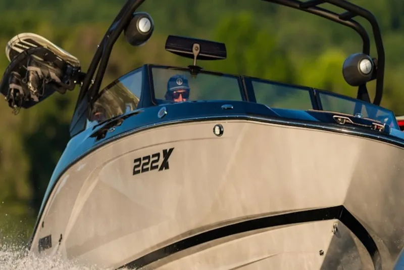 Slide: The Image of 2027 Yamaha Boats 222XD cruising on water, showcasing sleek design and modern features. - 9