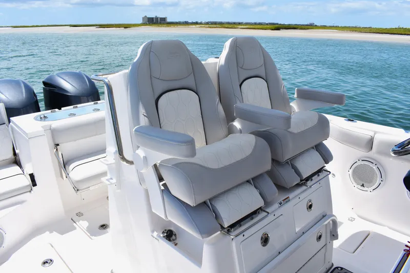 Slide: The Image of 2020 Sea Fox 288 Commander boat seats with ocean view in background. - 20