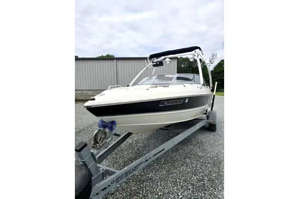 Slide: The Image of 2008 Stingray 205 LS/LX/LR boat on trailer, parked outdoors. - 1