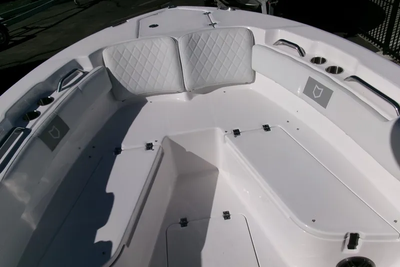 Slide: The Image of 2026 Sea Fox 248 Commander boat interior with white seating and storage compartments. - 9