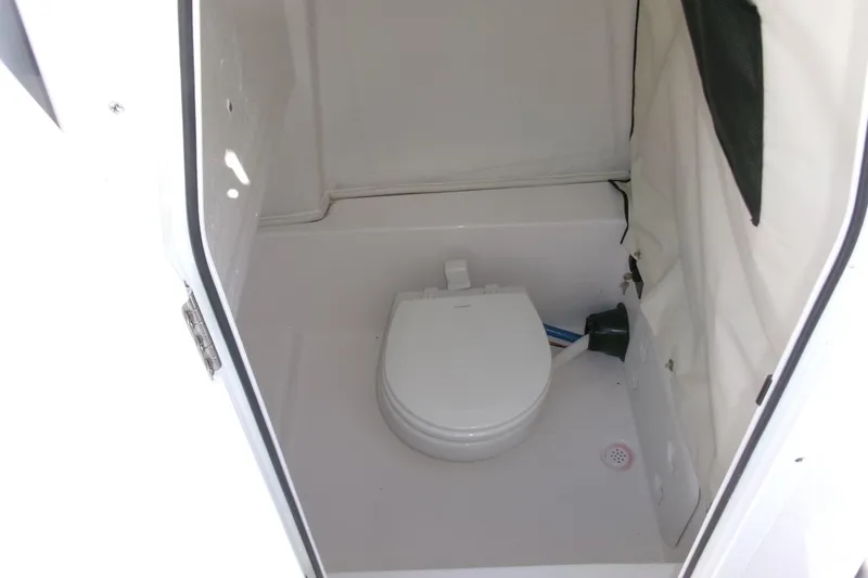 Slide: The Image of 2026 Sea Fox 248 Commander boat interior with compact marine toilet. - 16
