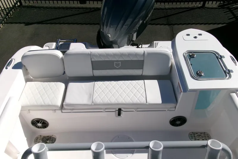 Slide: The Image of 2026 Sea Fox 248 Commander boat interior with cushioned seating and storage compartments. - 25