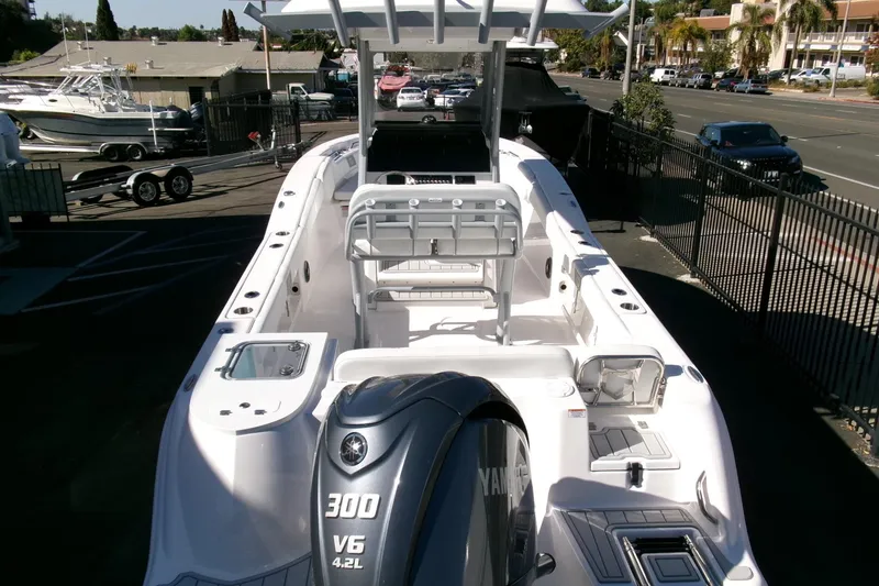 Slide: The Image of 2026 Sea Fox 248 Commander boat with Yamaha 300 V6 engine, docked outdoors. - 34
