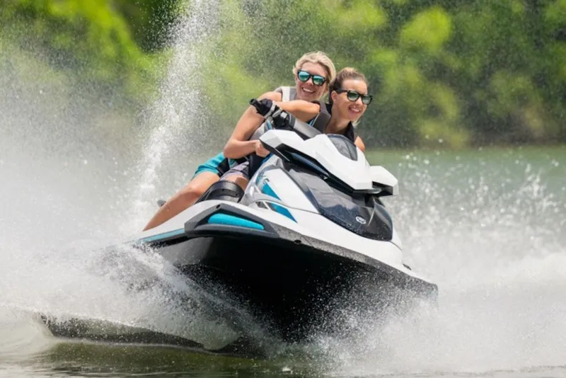Slide: The Image of Two people enjoying a ride on a 2027 Yamaha Boats VX-C jet ski. - 1