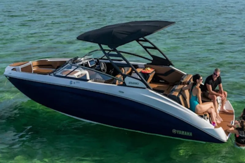 Slide: The Image of 2026 Yamaha Boats 252SD on clear water with passengers enjoying the sun. - 4