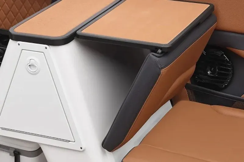 Slide: The Image of 2026 Yamaha Boats 252SD interior with tan and black seating, featuring a built-in speaker. - 8