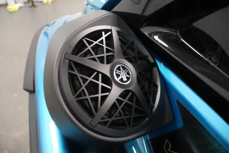 Slide: The Image of 2027 Yamaha WaveRunner VX Limited speaker detail in sleek black and blue design. - 18