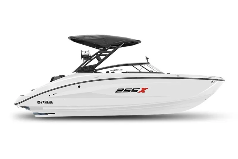 The Image of 2027 Yamaha Boats 255XD, sleek white design with black canopy, side view. - 1