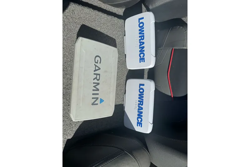 Slide: The Image of Garmin and Lowrance Hook devices on 2022 Tracker Pro Team 190 TX boat interior. - 19