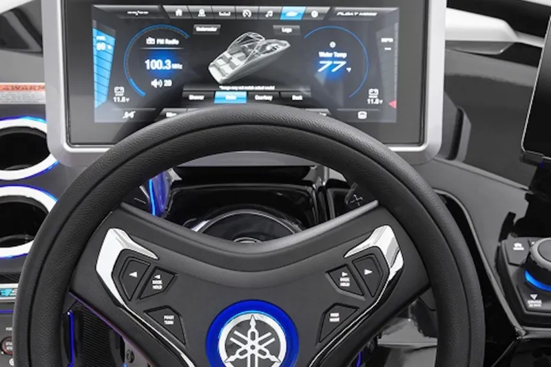 Slide: The Image of Steering wheel and dashboard of 2027 Yamaha Boats 275SD, featuring advanced digital display. - 8