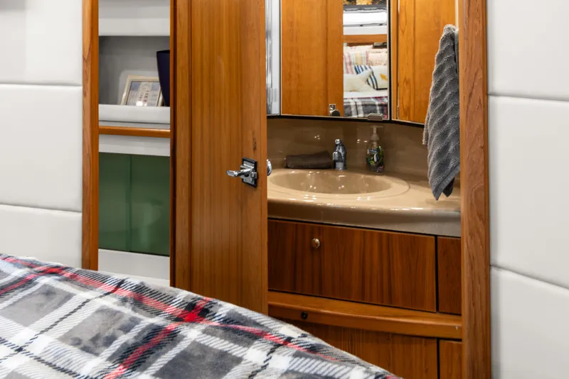 Slide: The Image of Interior of 2000 Bayliner 4087 Aft Cabin Motoryacht with wooden cabinetry and sink. - 22