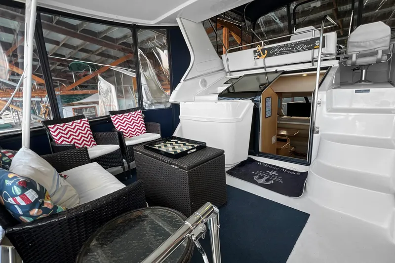 Slide: The Image of Luxurious 2000 Bayliner 4087 Aft Cabin Motoryacht interior with stylish seating and decor. - 34