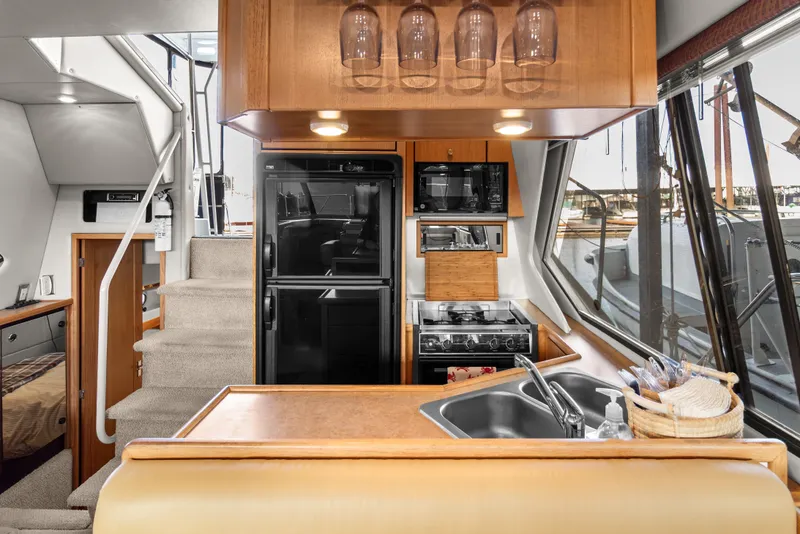 Slide: The Image of Interior of 2000 Bayliner 4087 Aft Cabin Motoryacht with kitchen and stairs. - 14
