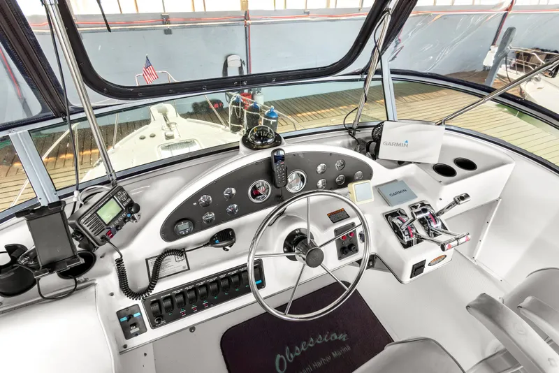 Slide: The Image of Cockpit of 2000 Bayliner 4087 Aft Cabin Motoryacht with navigation instruments and steering wheel. - 41