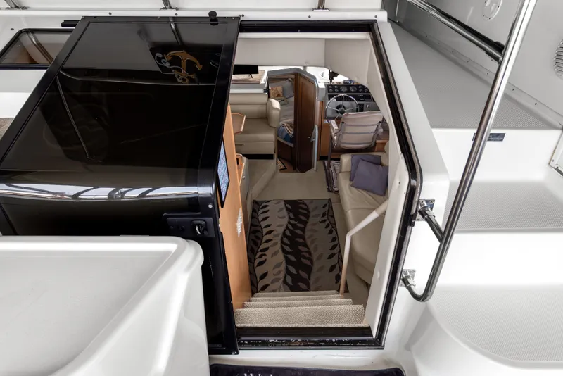 Slide: The Image of Interior view of 2000 Bayliner 4087 Aft Cabin Motoryacht, featuring stairs and seating area. - 31