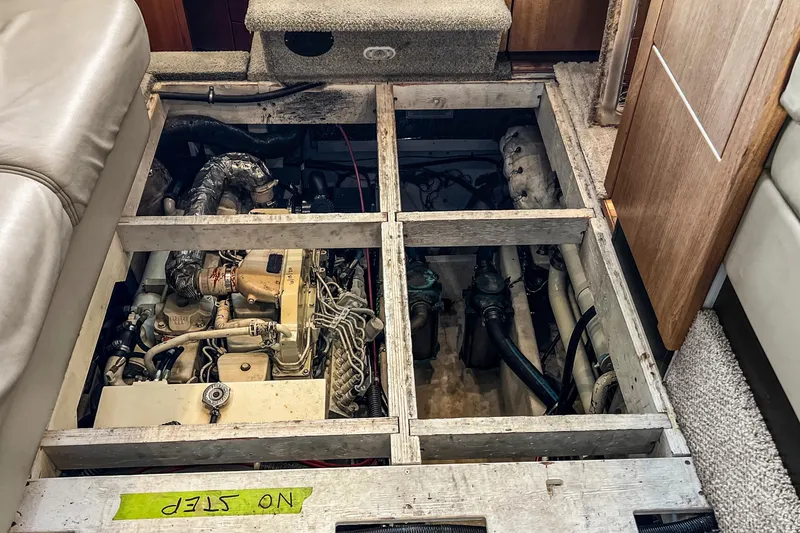 Slide: The Image of Engine compartment of 2000 Bayliner 4087 Aft Cabin Motoryacht, showcasing mechanical components. - 51