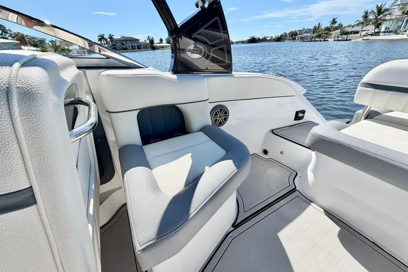 Slide: The Image of Interior of a 2020 Cobalt 23SC boat with luxurious seating and scenic water view. - 9