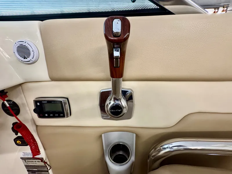 Slide: The Image of Close-up of the throttle lever and controls in a Chris-Craft Carina 21 boat. - 27