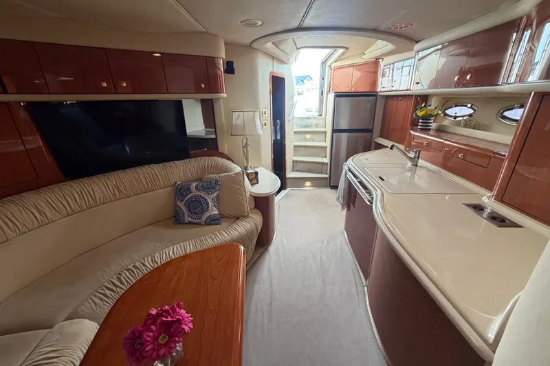 Slide: The Image of Luxurious interior of 1998 Sea Ray Sundancer 540 yacht with elegant seating and modern kitchen. - 17