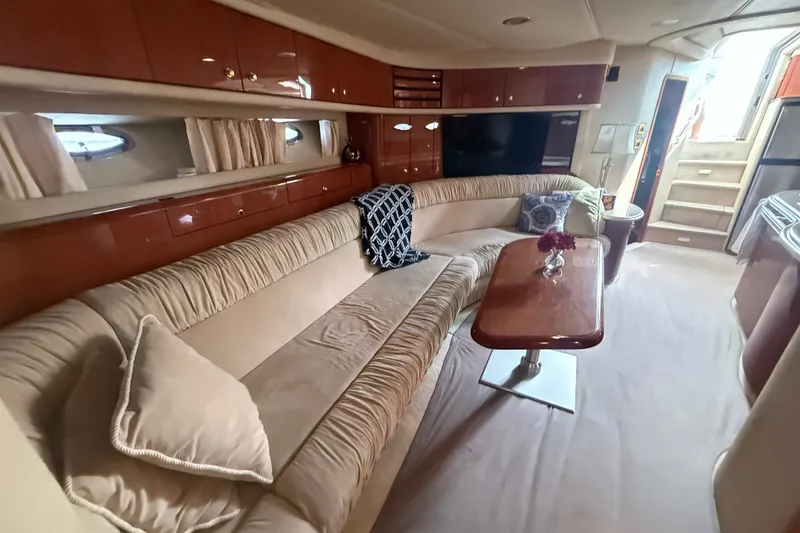 Slide: The Image of Luxurious interior of 1998 Sea Ray Sundancer 540 yacht with plush seating and elegant decor. - 23