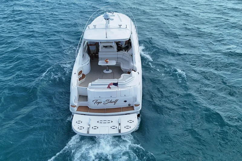 Slide: The Image of Aerial view of 1998 Sea Ray Sundancer 540 yacht cruising on open water. - 30