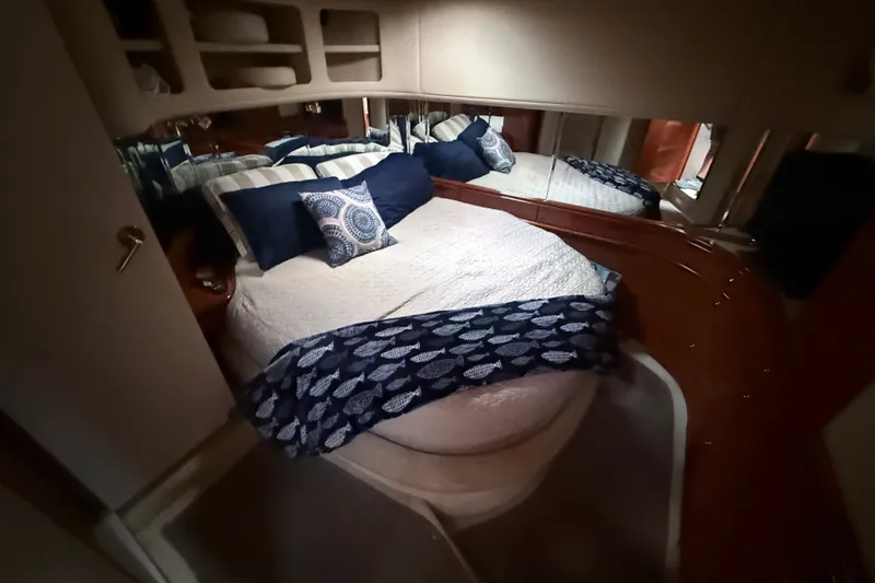 Slide: The Image of Luxurious cabin interior of 1998 Sea Ray Sundancer 540 yacht with cozy bedding. - 24