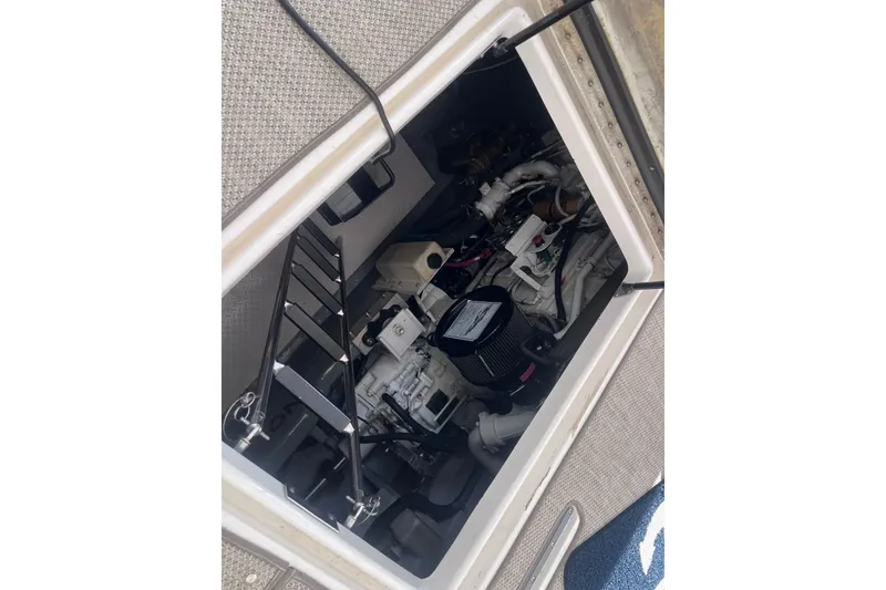 Slide: The Image of Engine compartment of a 1998 Sea Ray Sundancer 540 boat, showing mechanical components. - 44