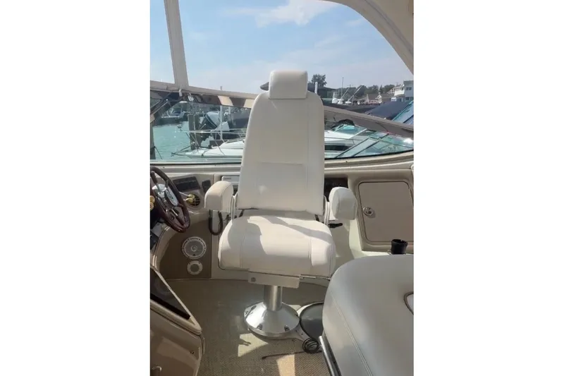 Slide: The Image of Captain's chair on 1998 Sea Ray Sundancer 540 yacht, overlooking marina. - 41