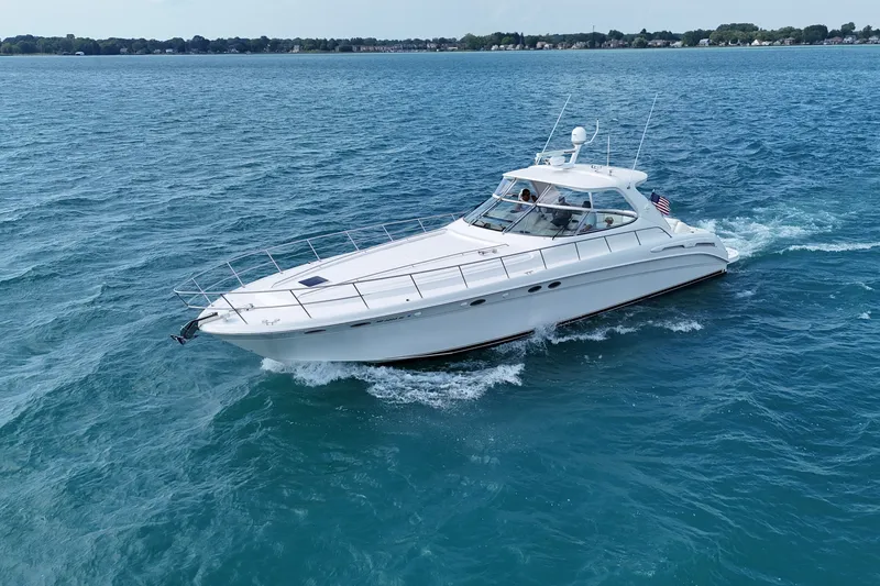 The Image of 1998 Sea Ray Sundancer 540 cruising on open water, showcasing sleek design and luxury. - 1