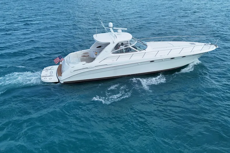 Slide: The Image of 1998 Sea Ray Sundancer 540 cruising on open blue waters. - 31